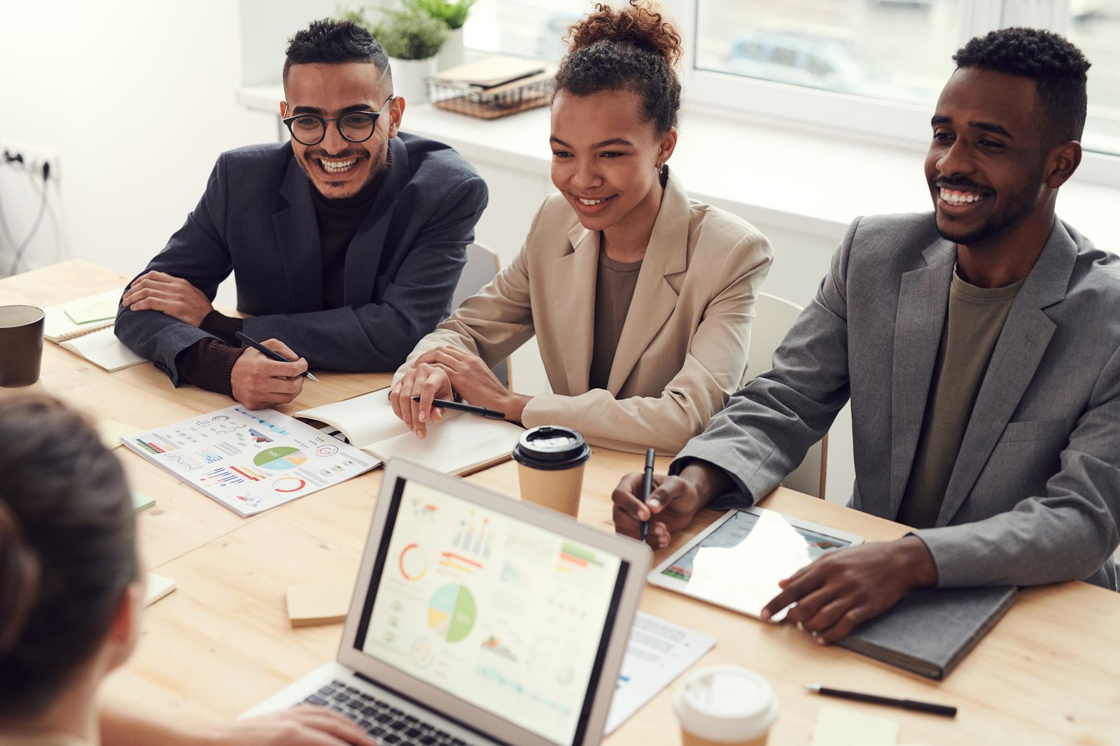 Multicultural business team working together around a table