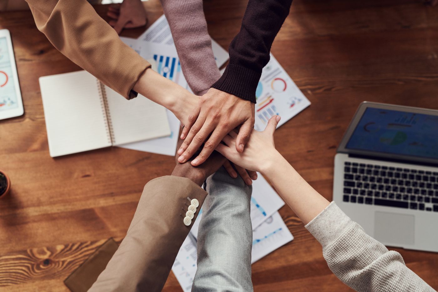 Professionals collaborating across a meeting table